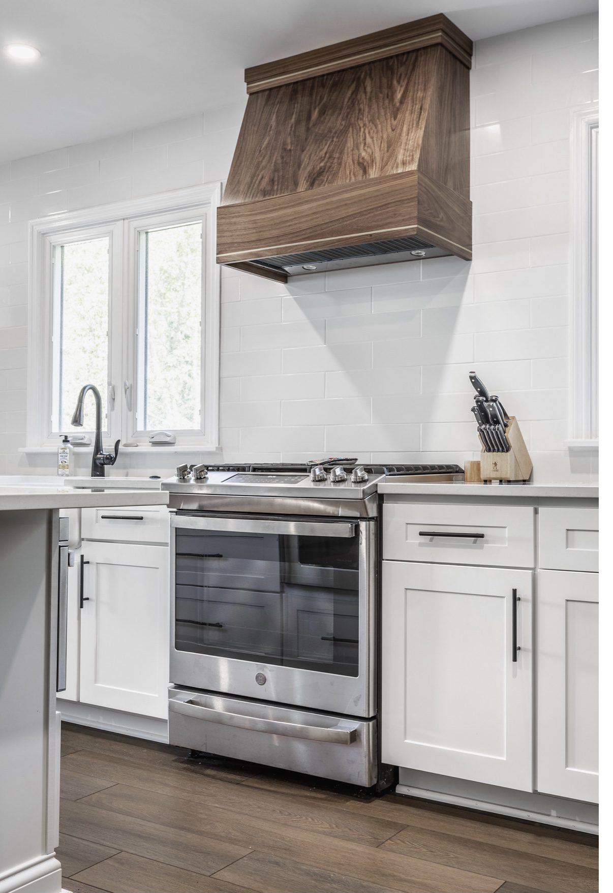 Gallery 35 Custom walnut range hood with brass inlays by RInes Design