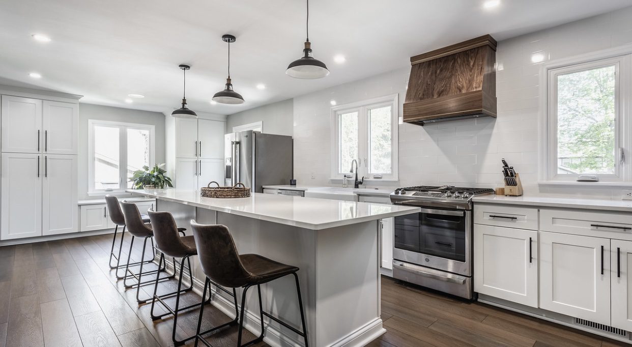 Gallery 2 Kitchen remodel, cabinets, and custom walnut range hood with brass inlays by RInes Design