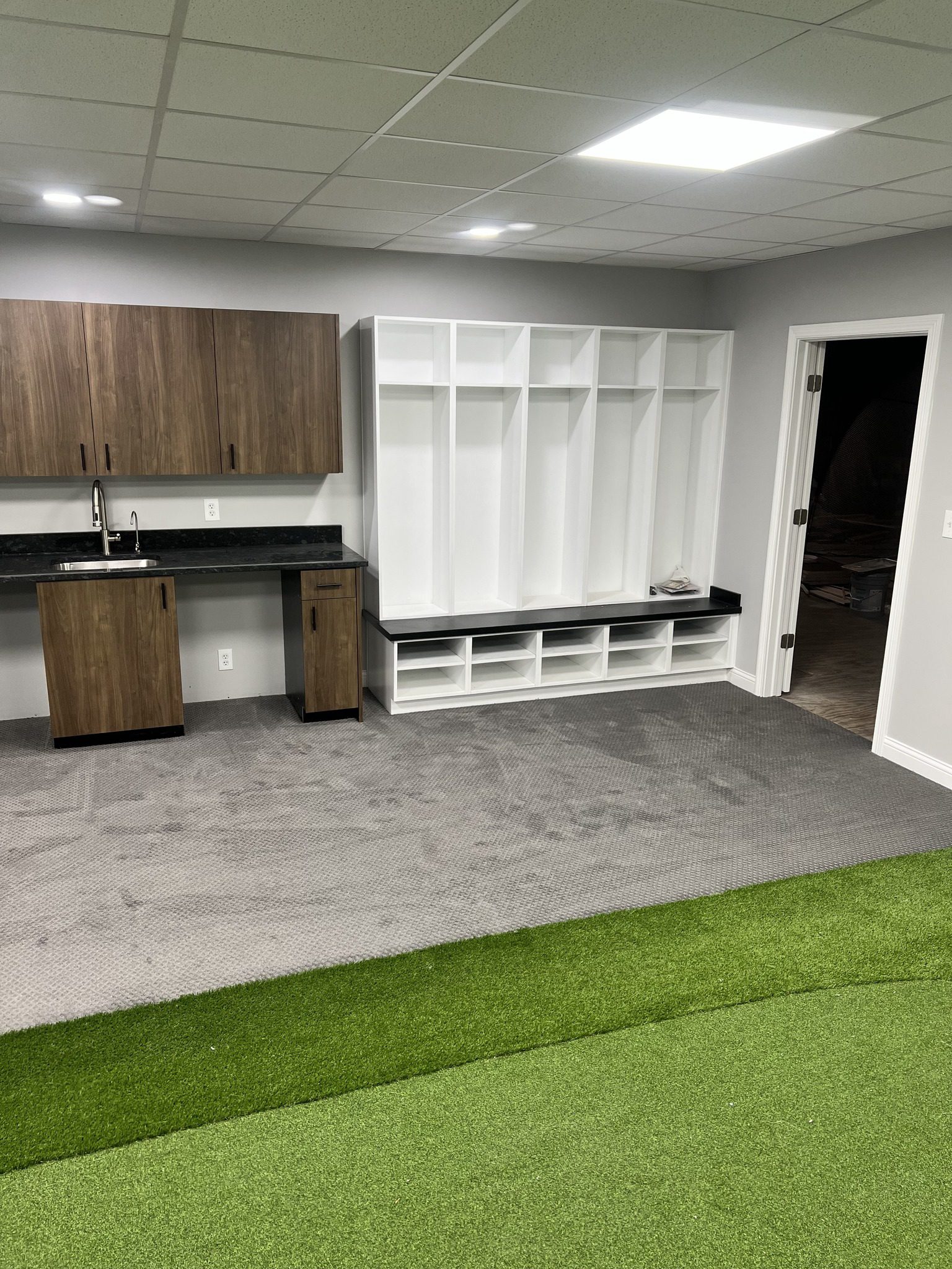 Gallery 4 Custom wet bar and sports lockers by RInes Design
