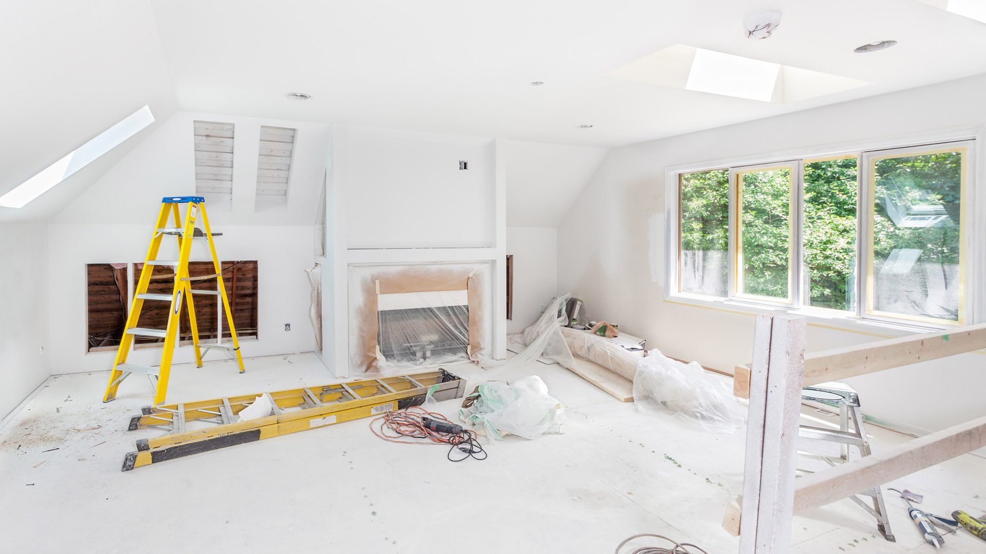 Home Renovation 3 One skylight installed with interior cutouts finished on two more. Fireplace and cabinet cutouts complete